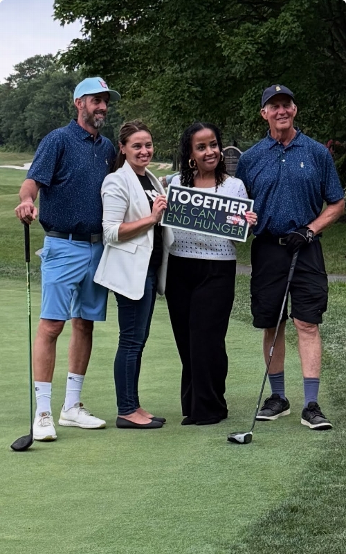 Golfers and supporters on the course